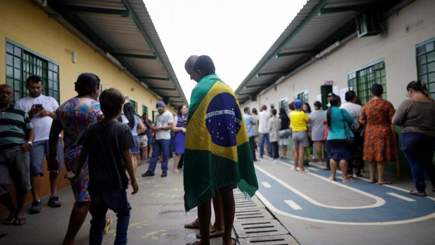 Editorial illustration of Brazilian voters approaching a polling station in Brasília, with Brazil's flag at sunset